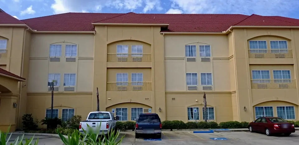 Before: a three-story wing in the original yellow paint